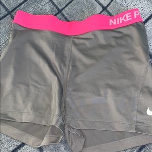 Grey and pink Nike pros